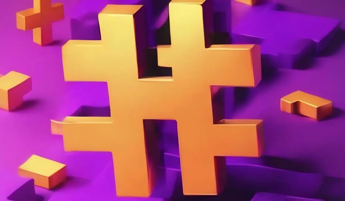 Un gran símbolo de hashtag tridimensional de color naranja se destaca sobre un fondo morado con formas más pequeñas similares, ilustrando la hashtagización de la comunicación en el panorama digital actual.