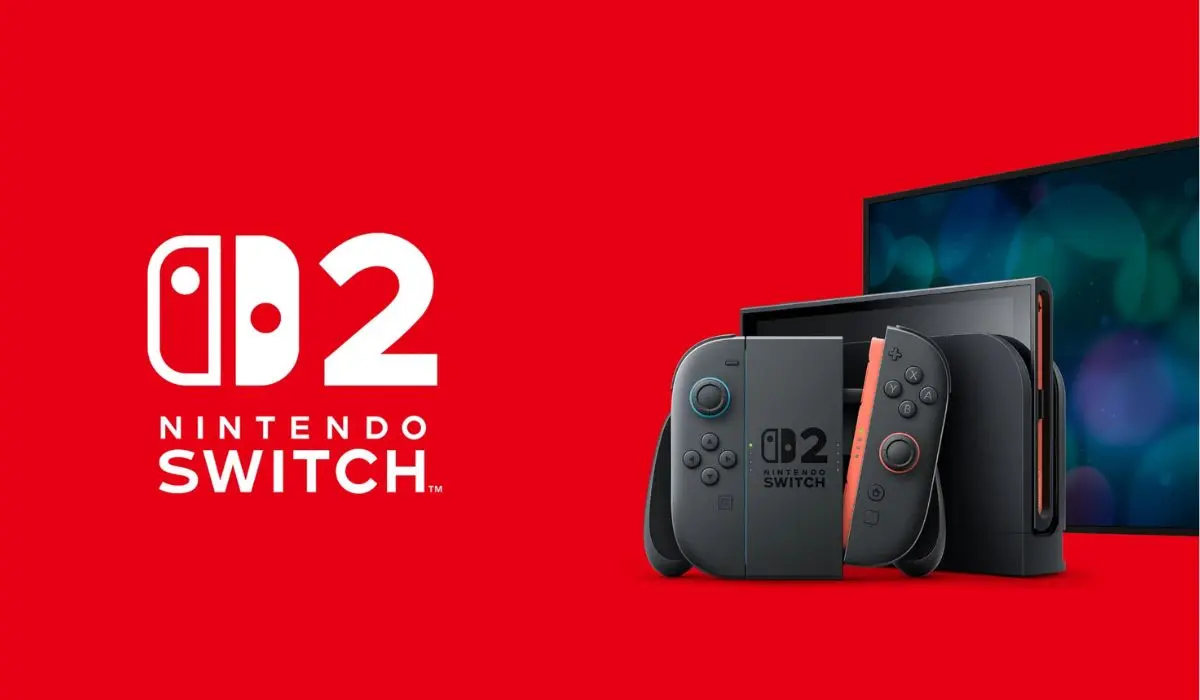 La consola Nintendo Switch 2 y los controles Joy-Con se muestran sobre un fondo rojo, con una pantalla de TV borrosa parcialmente visible.